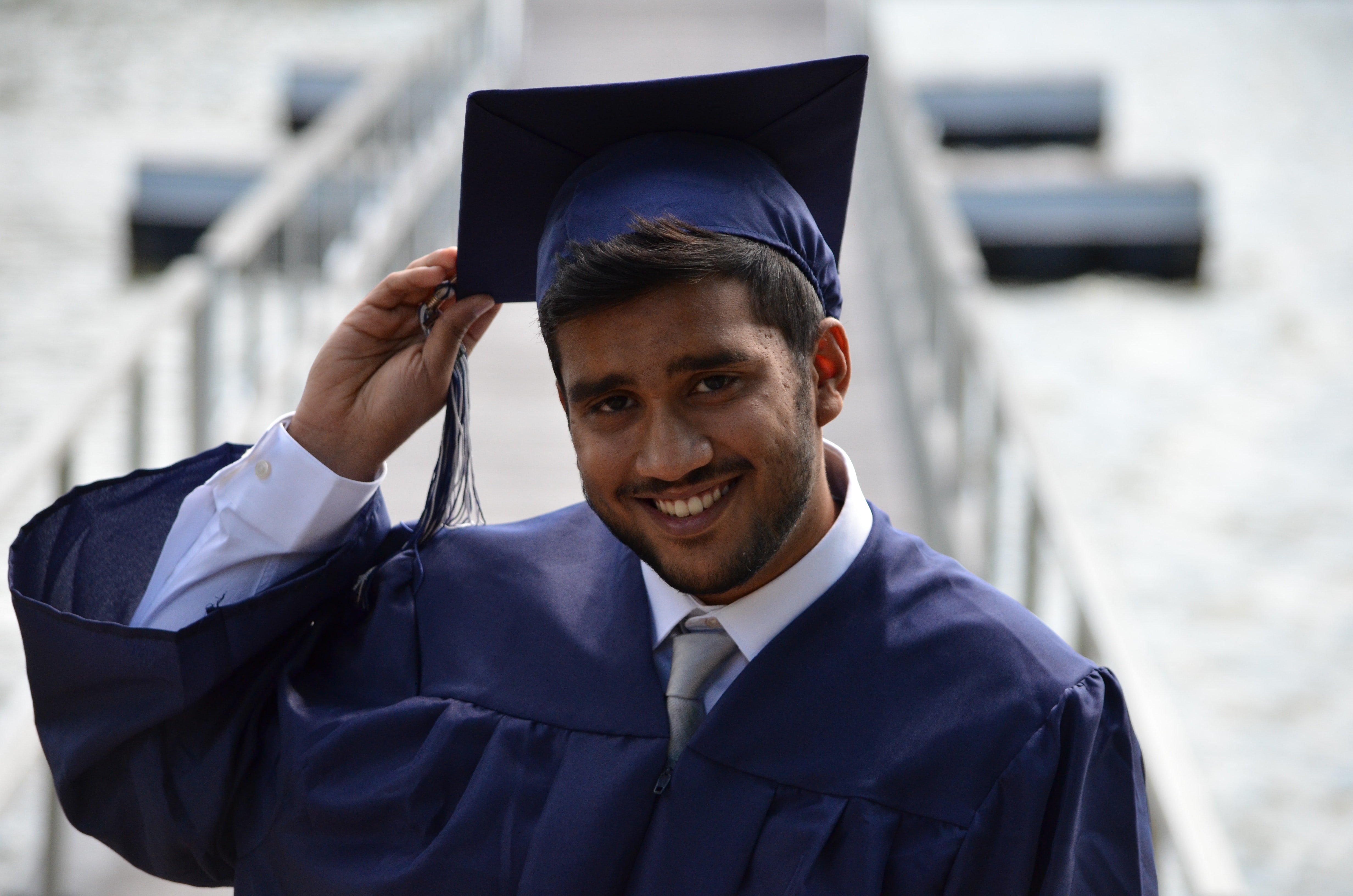 Man Holding His Graduation Hat
