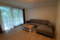 living room with floor-to ceiling-windows and spacious sofa in L-form