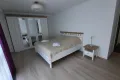 bedroom with double bed, spacious wardrobe, bedside table