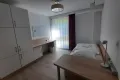 bedroom with bed, two desks, spacious wardrobe