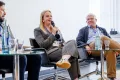 Panelist speaking into a Microphone at the Academic Freedom Forum