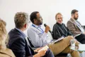 Panelist speaking into a Microphone at the Academic Freedom Forum