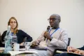 Panelist speaking into a Microphone at the Academic Freedom Forum