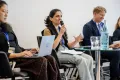 Panelist speaking into a Microphone at the Academic Freedom Forum