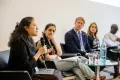 Panelist speaking into a Microphone at the Academic Freedom Forum