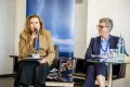 Panelist speaking into a Microphone at the Academic Freedom Forum
