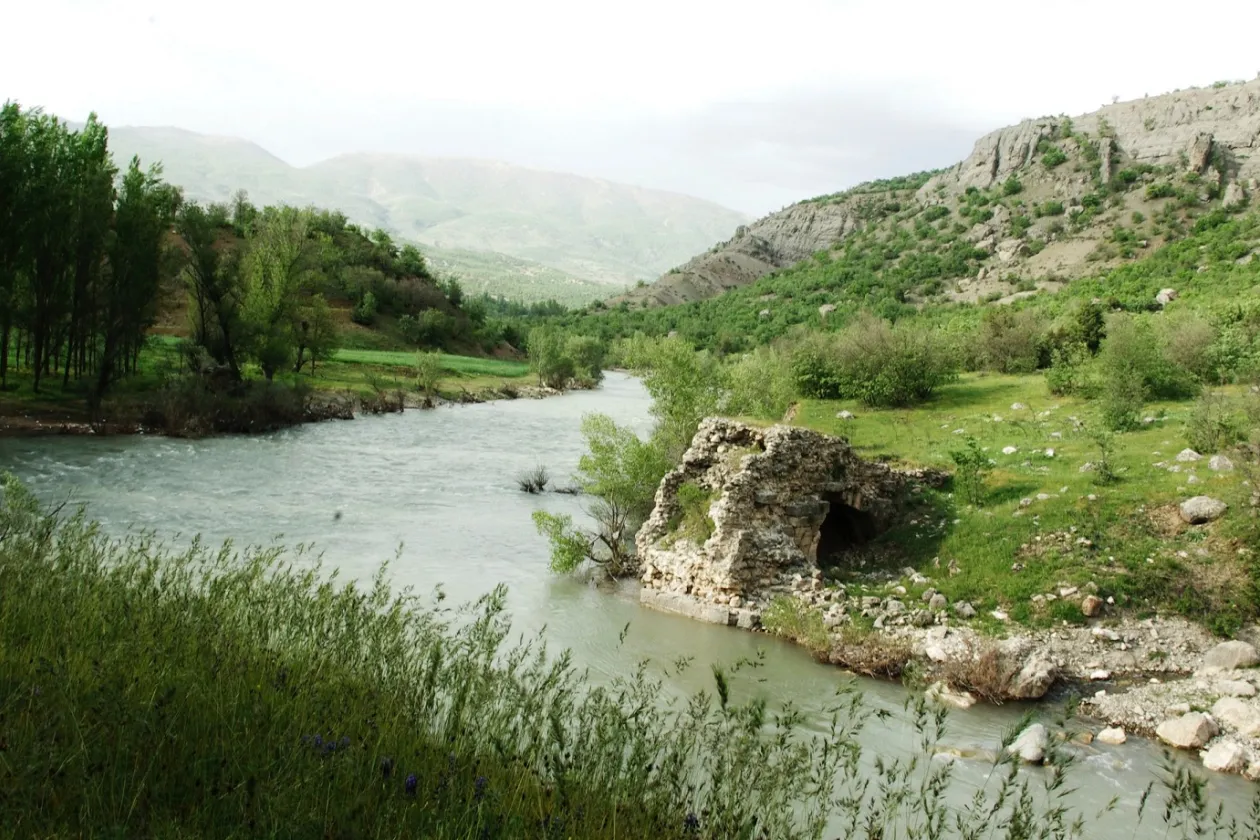 landscape with river in the front an mountains in the back