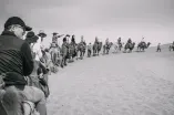 Tourists riding camels
