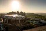 The photo shows the Audimax on RUB campus.