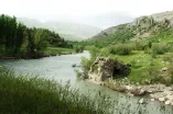 landscape with river in the front an mountains in the back