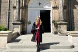 Anna standing in front of the University of St Andrews