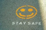 Smiley Graffiti on the Asphalt; Stay Safe