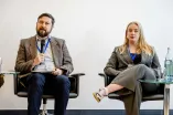 Panelist speaking into a Microphone at the Academic Freedom Forum