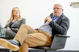 Panelist speaking into a Microphone at the Academic Freedom Forum