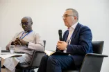 Panelist speaking into a Microphone at the Academic Freedom Forum