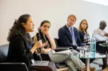 Panelist speaking into a Microphone at the Academic Freedom Forum