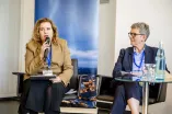Panelist speaking into a Microphone at the Academic Freedom Forum