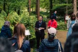  A man at the RUB Botanical Gardens speaks to the other Paticipants of the Garden of Sanctuary Walk.