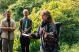  A woman at the RUB Botanical Gardens speaks to the other Paticipants of the Garden of Sanctuary Walk.