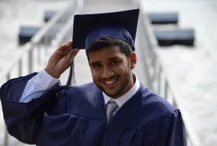 Man Holding His Graduation Hat