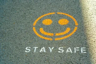 Smiley Graffiti on the Asphalt; Stay Safe