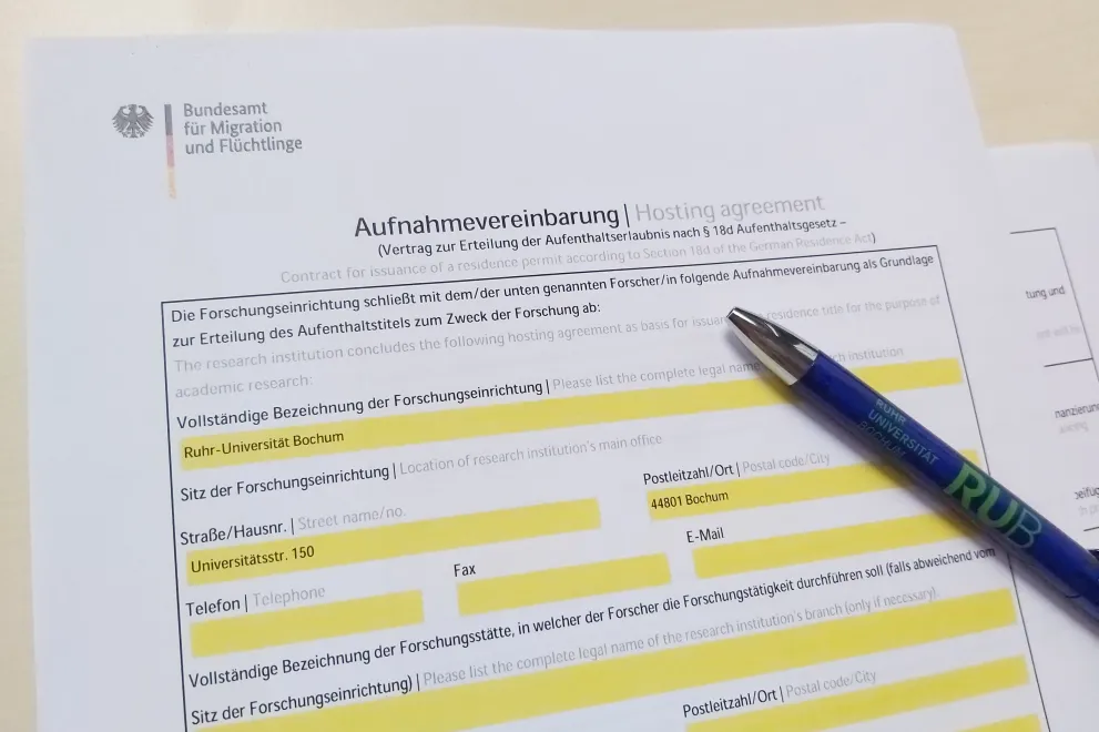 Foto einer Aufnahmevereinbarung für internationale Wissenschaftler