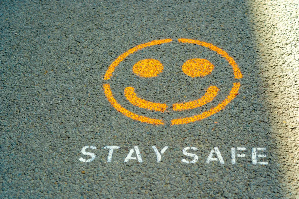 Smiley Graffiti on the Asphalt; Stay Safe