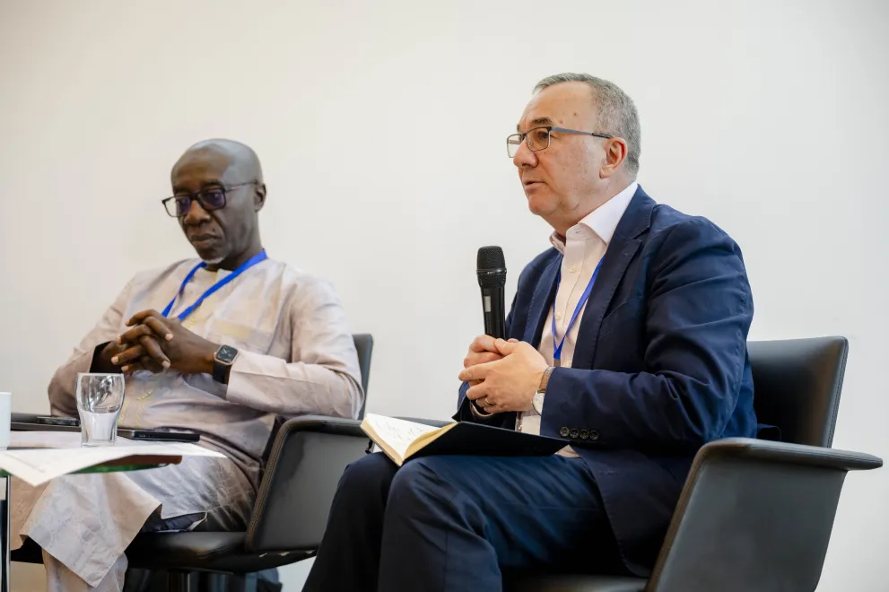 Panelist speaking into a Microphone at the Academic Freedom Forum