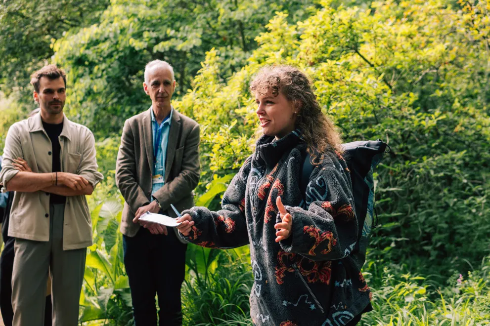  A woman at the RUB Botanical Gardens speaks to the other Paticipants of the Garden of Sanctuary Walk.